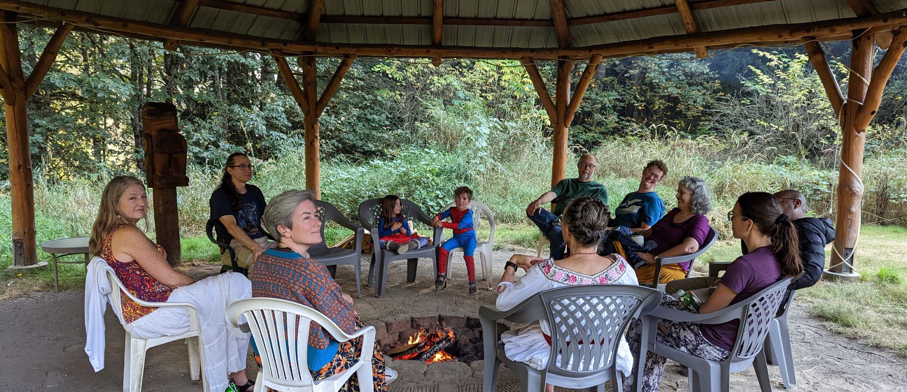 Sacred Fire community gathered around a fire